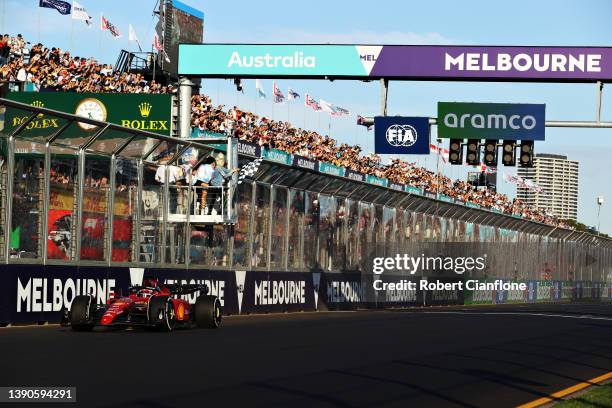 Race winner Charles Leclerc of Monaco driving the Ferrari F1-75 takes the chequered flag during the F1 Grand Prix of Australia at Melbourne Grand...