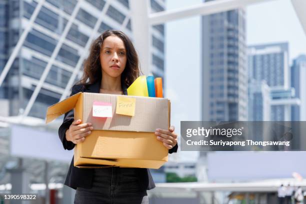 businesswoman unhappy or sadness cause being fired from company. business concept background. - lay off stock pictures, royalty-free photos & images