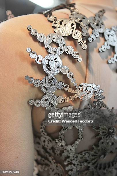 Model prepares backstage before the threeASFOUR Fall 2012 fashion show during Mercedes-Benz Fashion Week at the The Hole on February 15, 2012 in New...