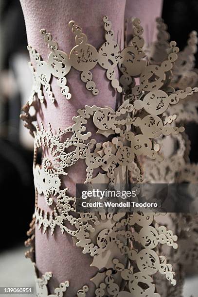 Model prepares backstage before the threeASFOUR Fall 2012 fashion show during Mercedes-Benz Fashion Week at the The Hole on February 15, 2012 in New...