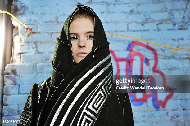 Model prepares backstage before the threeASFOUR Fall 2012 fashion show during Mercedes-Benz Fashion Week at the The Hole on February 15, 2012 in New...