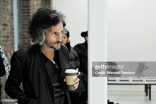 Fashion designer Gabriel Asfour prepares before the threeASFOUR Fall 2012 fashion show during Mercedes-Benz Fashion Week at the The Hole on February...