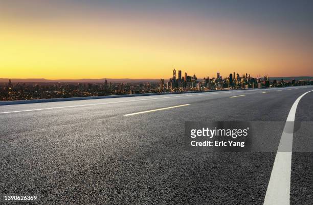highway to city - multiple lane highway stock pictures, royalty-free photos & images