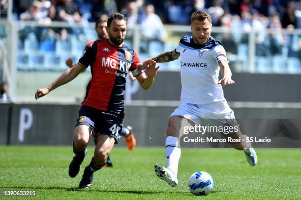 Ciro Immobile of SS Lazio compete for the ball with Milan Badelj of Genoa CFC during the Serie A match between Genoa CFC v SS Lazio on April 10, 2022...