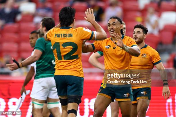 Dietrich Roache and Henry Paterson of Australia celebrate after their 21-19 win over Ireland in the bronze final match during the HSBC Singapore...