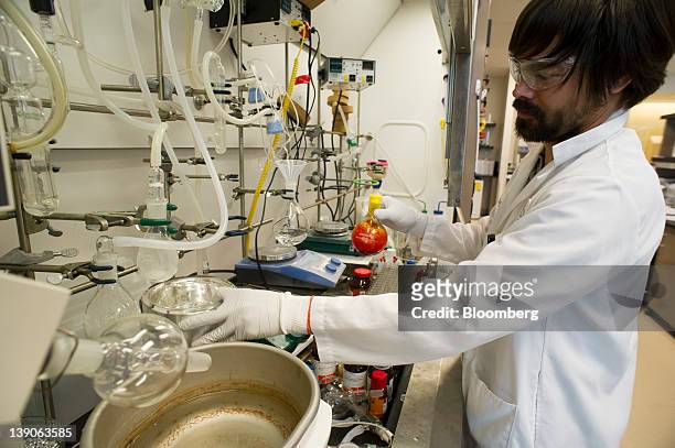 Darryl Kato, research scientist for Gilead Sciences Inc., works on the synthesis of a potential hepatitis C virus drug candidate at the company's lab...