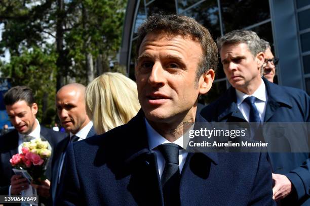 French President Emmanuel Macron salutes the crowd as he arrives to the poll station on April 10, 2022 in Le Touquet-Paris-Plage, France. Nearly 50...