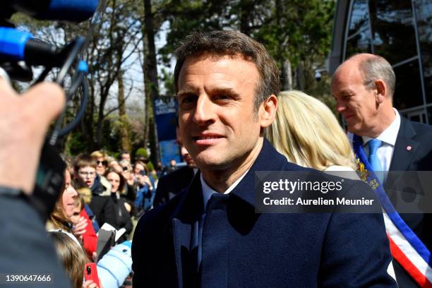 French President Emmanuel Macron salutes the crowd as he arrives to the poll station on April 10, 2022 in Le Touquet-Paris-Plage, France. Nearly 50...