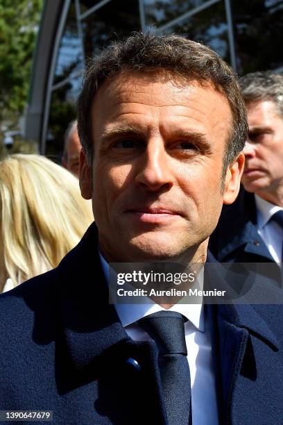 French President Emmanuel Macron salutes the crowd as he arrives to the poll station on April 10, 2022 in Le Touquet-Paris-Plage, France. Nearly 50...