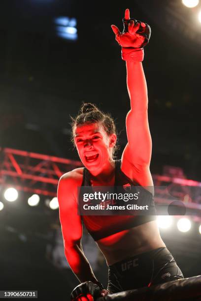 Mackenzie Dern reacts after her victory over Tecia Torres in their strawweight fight during the UFC 273 event at VyStar Veterans Memorial Arena on...