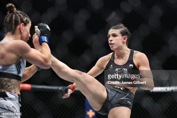 Mackenzie Dern kick Tecia Torres in their strawweight fight during the UFC 273 event at VyStar Veterans Memorial Arena on April 09, 2022 in...