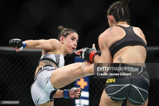 Tecia Torres kicks Mackenzie Dern in their strawweight fight during the UFC 273 event at VyStar Veterans Memorial Arena on April 09, 2022 in...