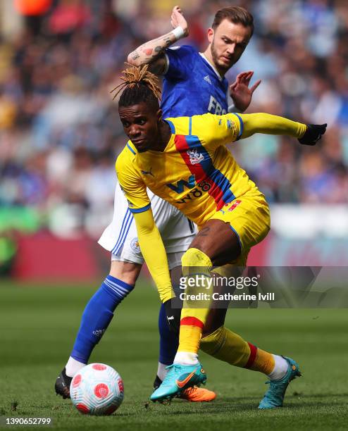Wilfried Zaha of Crystal Palace battles for possession with James Maddison of Leicester City during the Premier League match between Leicester City...