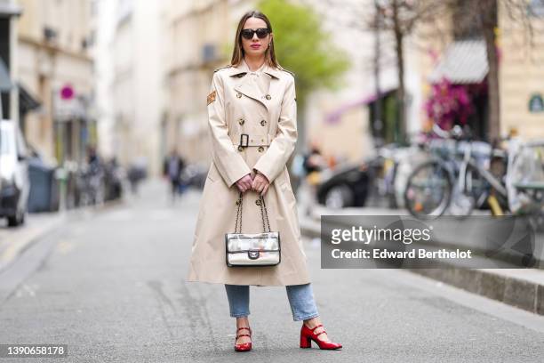 Maria Rosaria Rizzo @lacoquetteitalienne wears black sunglasses, gold and pearls earrings from Chanel, a white latte shirt, a beige buttoned long...