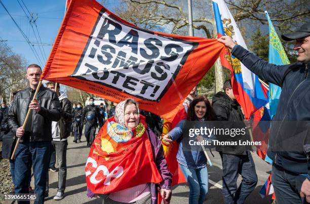 People gather to show their support for Russia at a demonstration that was taking place under the motto "Against Baiting And Discrimination of...