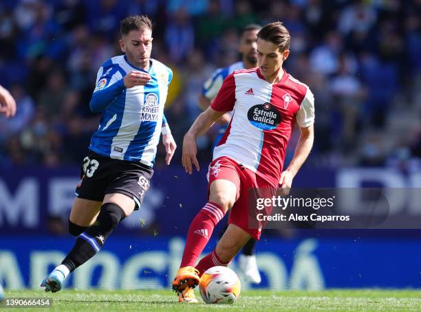 Denis Suárez of Celta Vigo challenged by Adrián Embarba of Espanyol during the La Liga Santander match between RCD Espanyol and RC Celta de Vigo at...