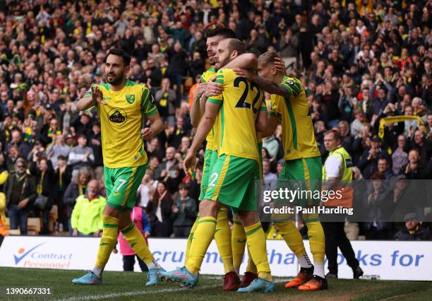 Teemu Pukki of Norwich City celebrates with team mates after scoring their sides second goal during the Premier League match between Norwich City and...