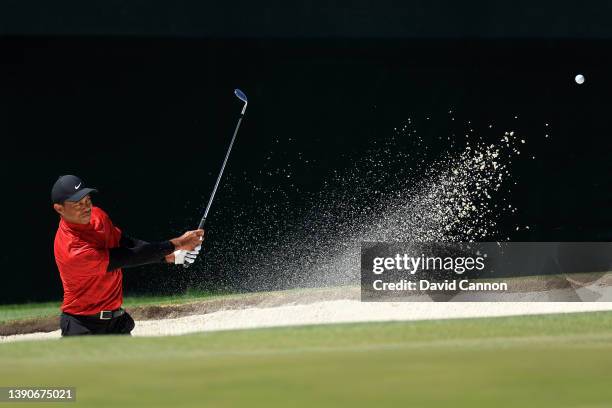 Tiger Woods plays his shot from the bunker on the third holeduring the final round of the Masters at Augusta National Golf Club on April 10, 2022 in...