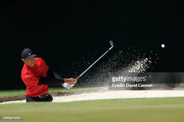 Tiger Woods plays his shot from the bunker on the fourth hole during the final round of the Masters at Augusta National Golf Club on April 10, 2022...