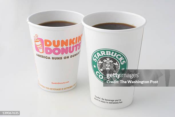 Dunkin' Donuts and Starbucks coffee cups. Photographed in the Washington Post Studio on September 6 in Washington, DC.