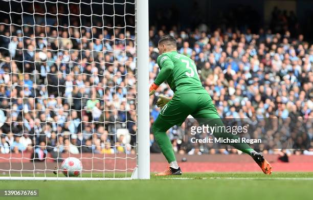 Ederson of Manchester City chases after the ball after almost allowing it to enter his own net during the Premier League match between Manchester...