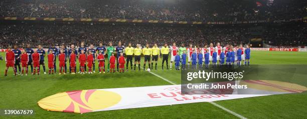 The two teams of Manchester United and AFC Ajax line up ahead of the UEFA Europa League round of 32 first leg match between AFC Ajax and Manchester...