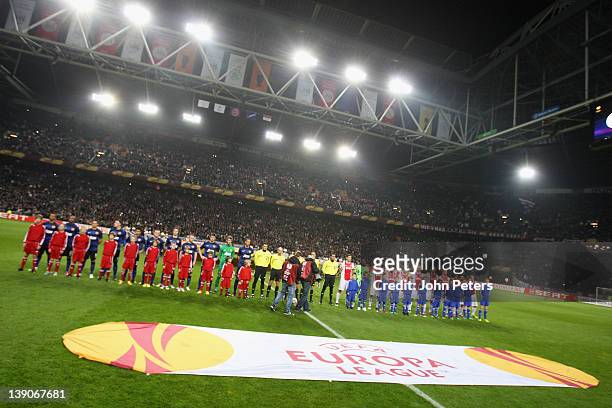 The two teams of Manchester United and AFC Ajax line up ahead of the UEFA Europa League round of 32 first leg match between AFC Ajax and Manchester...