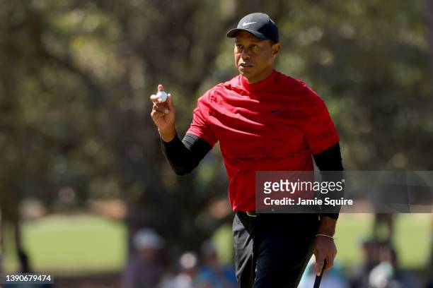 Tiger Woods reacts after making par on the third green during the final round of the Masters at Augusta National Golf Club on April 10, 2022 in...