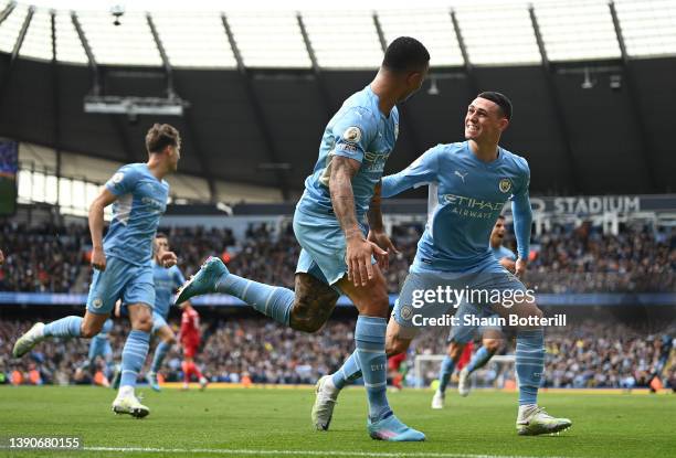 Gabriel Jesus of Manchester City celebrates with team mate Phil Foden after scoring their side's second goal during the Premier League match between...