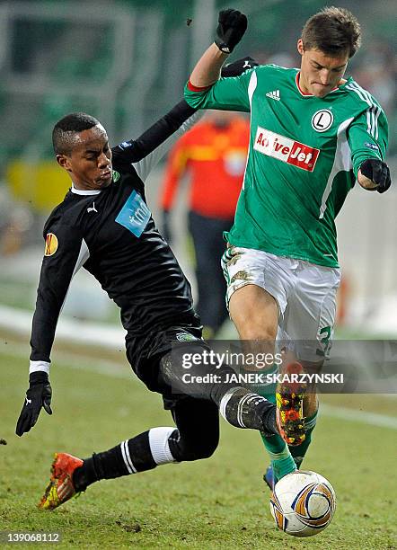 Legia Warsaw's Michal Zyro vies with Sporting Lisbon's Andre Carillo during their UEFA Europa League, round of 16, football match in Warsaw on...