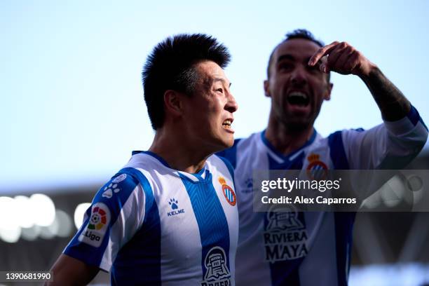 Wu Lei of RCD Espanyol celebrates with his teammate Sergi Darder after scoring his team's first goal during the La Liga Santander match between RCD...