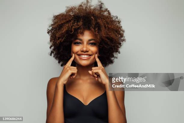 beautiful emotional afro woman with perfect make-up - wishful skin imagens e fotografias de stock