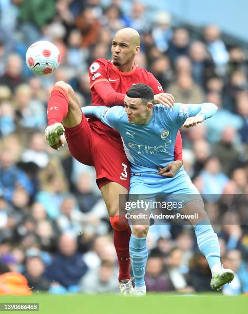 Fabinho of Liverpool with Phil Foden of Manchester City during the Premier League match between Manchester City and Liverpool at Etihad Stadium on...