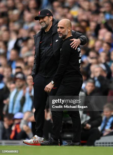 Pep Guardiola, Manager of Manchester City interacts with Jurgen Klopp, Manager of Liverpool during the Premier League match between Manchester City...