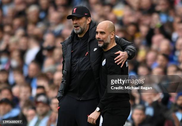 Pep Guardiola, Manager of Manchester City interacts with Jurgen Klopp, Manager of Liverpool during the Premier League match between Manchester City...