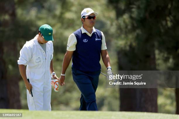 Hideki Matsuyama of Japan walks across the first hole during the final round of the Masters at Augusta National Golf Club on April 10, 2022 in...