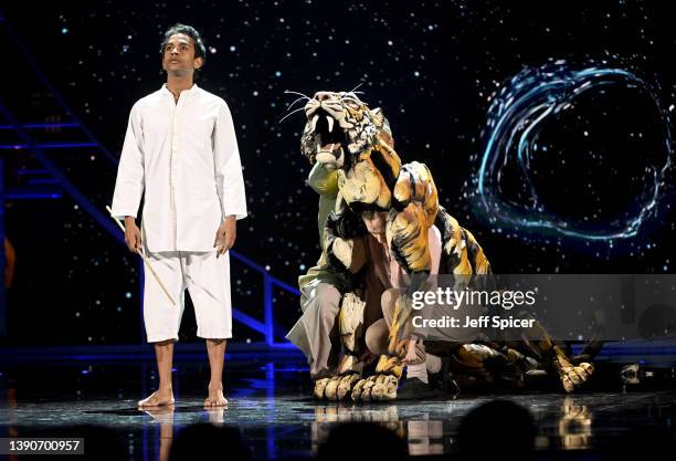 Hiran Abeysekera performs on stage with the cast of "Life of Pi" during The Olivier Awards 2022 with MasterCard at the Royal Albert Hall on April 10,...