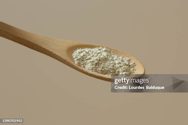 flour, clay, powder, ingredient in wooden spoon, close up view - oat ear stock pictures, royalty-free photos & images