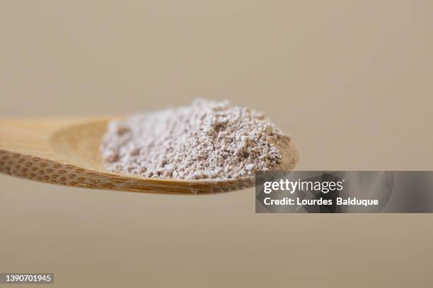 flour, clay, powder, ingredient in wooden spoon, close up view - oat ear stock pictures, royalty-free photos & images