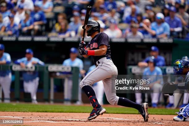 Oscar Mercado of the Cleveland Guardians hits a grand slam home run against the Kansas City Royals during the first inning at Kauffman Stadium on...