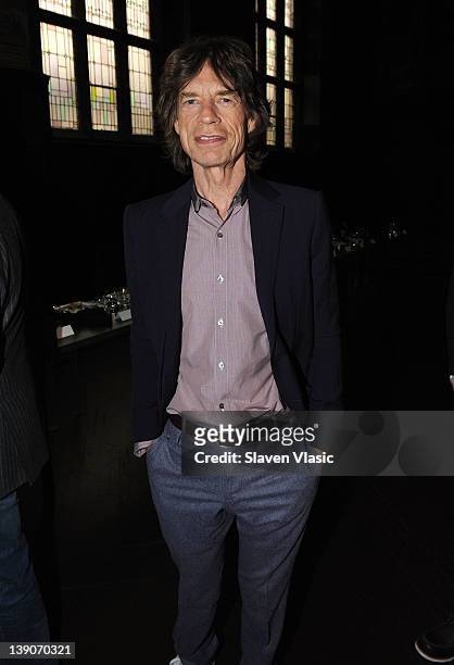 Musician Mick Jagger attends the L'Wren Scott Fall 2012 fashion show during Mercedes-Benz Fashion Week at the Desmond Tutu Center on February 16,...