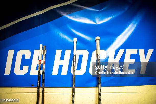 Hockey sticks before the game between the Middlebury Panthers and the Gustavus Adolphus Gusties during the NCAA Division III Women's Ice Hockey...