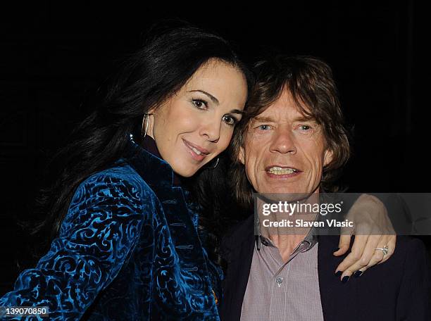 Designer L'Wren Scott and musician Mick Jagger pose at the L'Wren Scott Fall 2012 fashion show during Mercedes-Benz Fashion Week at the Desmond Tutu...