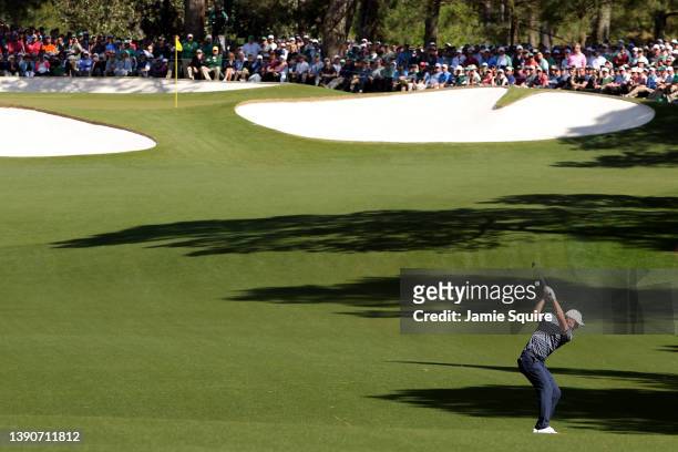 Scottie Scheffler plays his shot on the seventh hole during the final round of the Masters at Augusta National Golf Club on April 10, 2022 in...