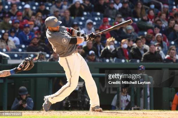 Nelson Cruz of the Washington Nationals singles in two runs in the eight inning during a baseball game against the New York Mets at the Nationals...