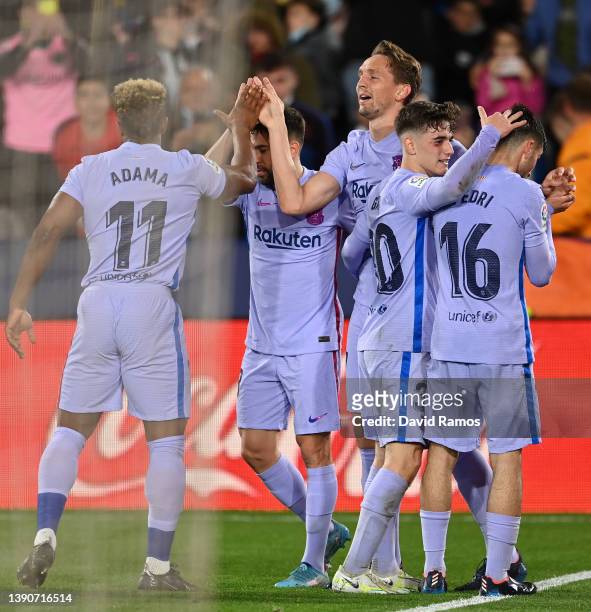 Luuk de Jong of FC Barcelona celebrates after scoring their side's third goal with team mates during the La Liga Santander match between Levante UD...