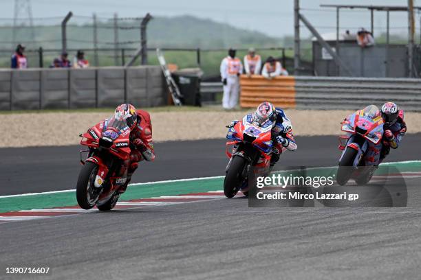 Jack Miller of Australia and Ducati Lenovo Team leads Jorge Martin of Spain and Pramac Racing and Enea Bastianini of Italy and Gresini Racing MotoGP...