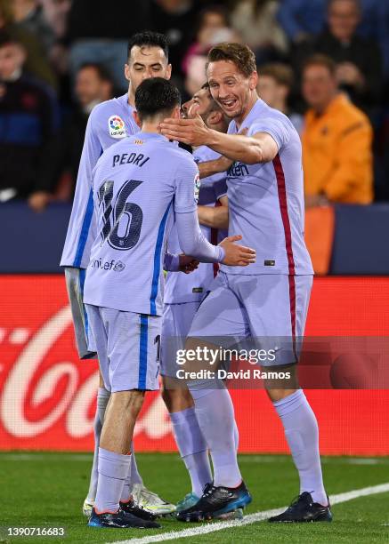 Luuk de Jong of FC Barcelona celebrates after scoring their side's third goal with team mates during the La Liga Santander match between Levante UD...