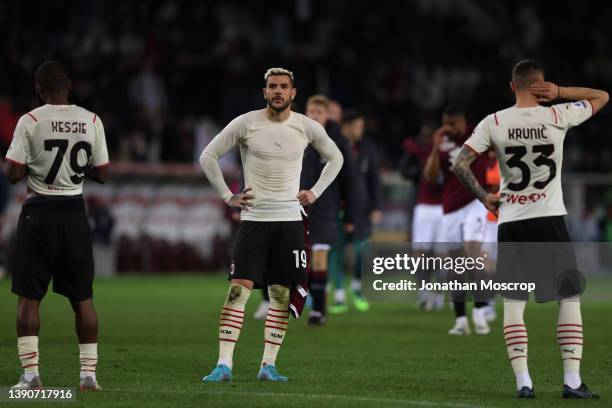 Theo Hernandez, Franck Kessie and Rade Krunic of AC Milan react to the 0-0 draw following the final whistle of the Serie A match between Torino FC v...