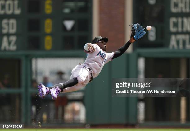 Jazz Chisholm Jr. #2 of the Miami Marlins makes a diving catch to take a hit away from Austin Slater of the San Francisco Giants in the bottom of the...